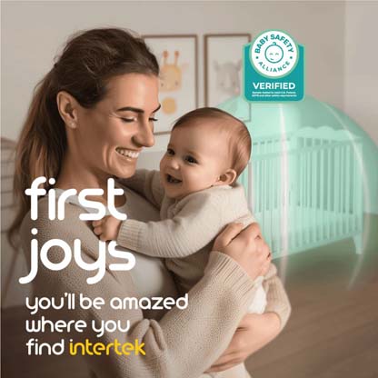 Woman holding a baby with crib surrounded by green light in the background