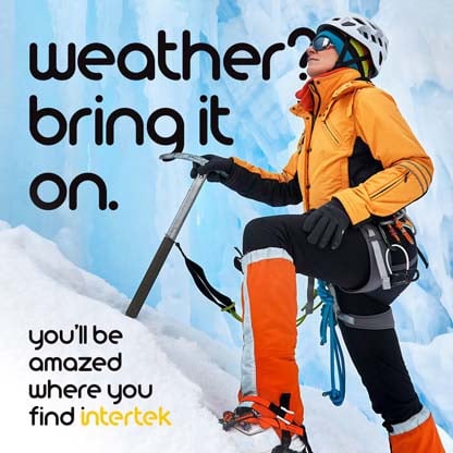 A mountain climber hiking up an icy slope